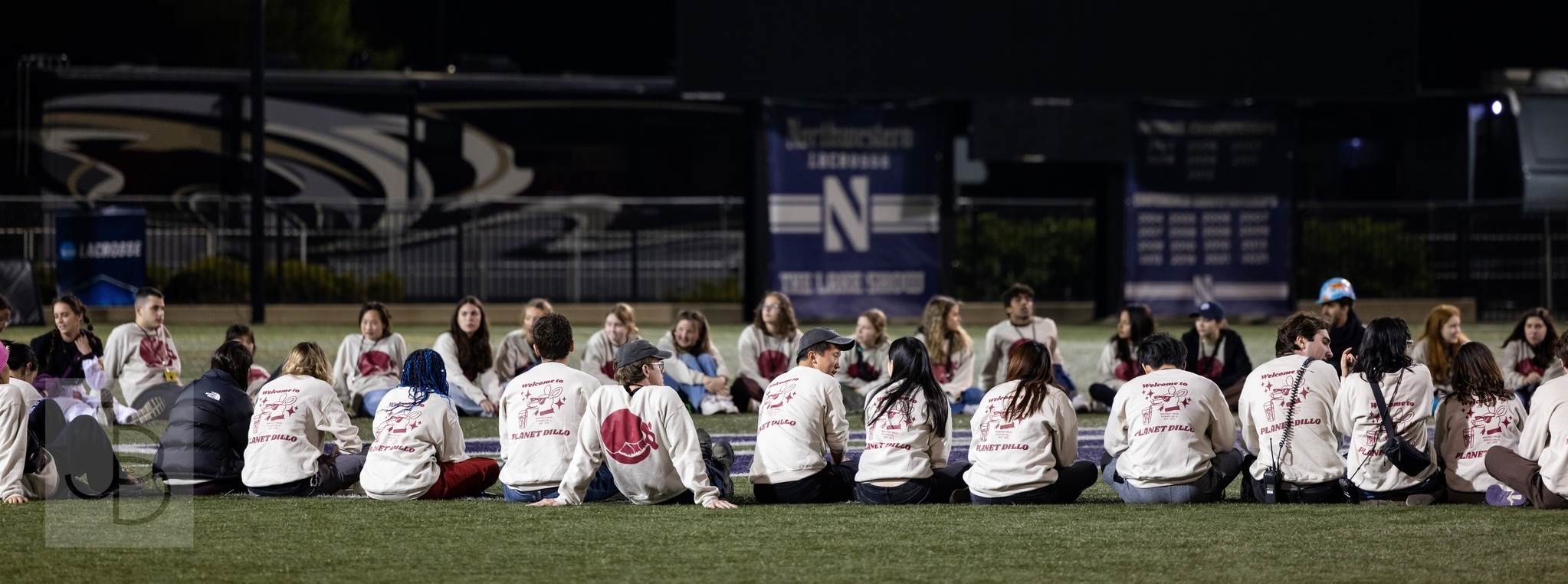 Mayfest Productions students sitting in a circle